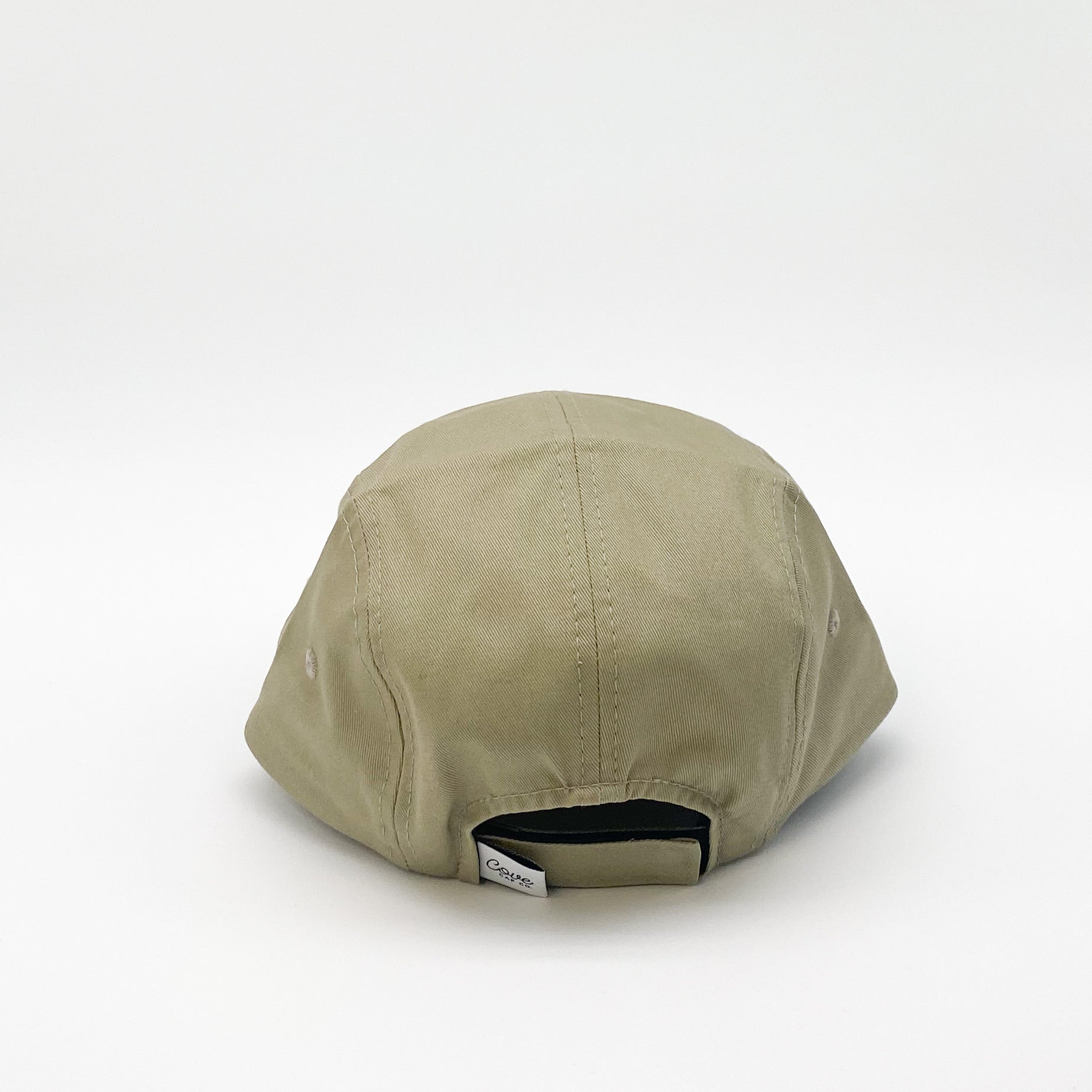 Khaki green kids hat. Minimalist five-panel design, made in Canada out of organic cotton. Hat has an adjustable soft velcro closure.