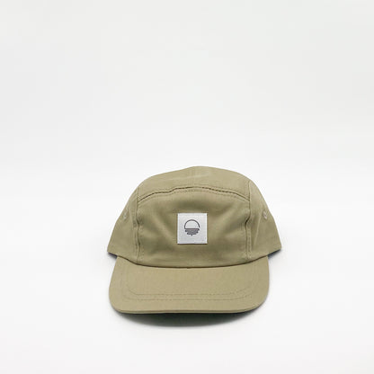 Khaki green toddler hat. Minimalist five-panel design, made in Canada out of organic cotton. Hat has an adjustable soft velcro closure.